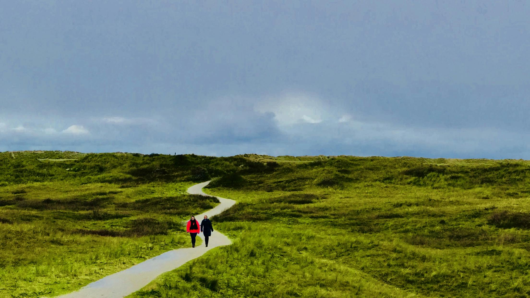 snapshot-sunday-walk-the-netherlands-705180.jpeg?cs=srgbu0026dl=two-person-walking-on-path-under-blue-sky-705180.jpgu0026fm=jpg