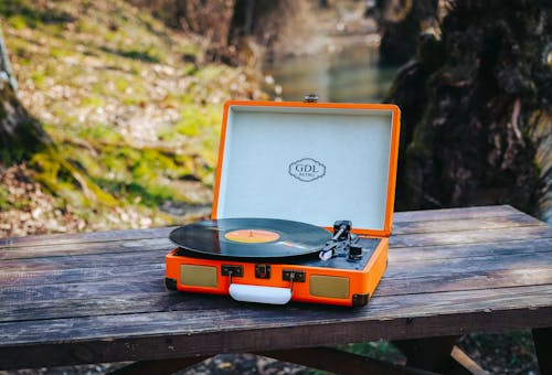 Free Close-Up Shot of a Portable Turntable on a Wooden Table Stock Photo
