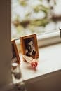 Wooden Picture Frame of Man on Window Sill