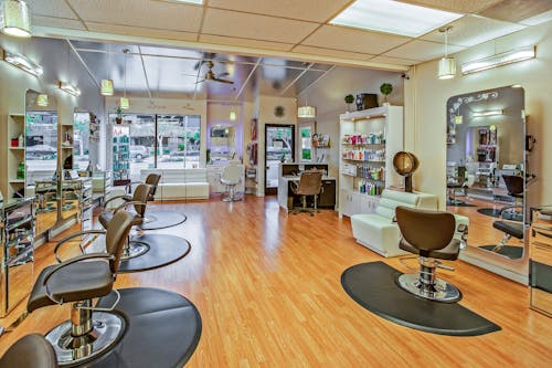 Free White And Brown Chairs Inside A Salon  Stock Photo