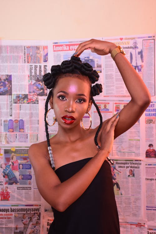 A Woman Posing with Her Hand on Her Head