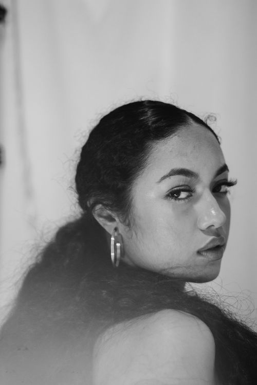 Free Monochrome portrait of a woman with a contemplative expression, showcasing natural beauty. Stock Photo