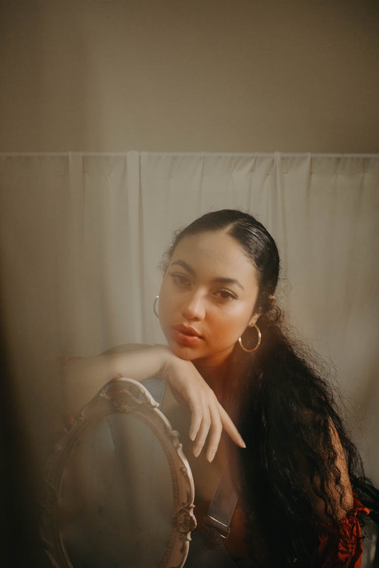 Portrait Of Young Woman With A Mirror In Steamy Bathroom