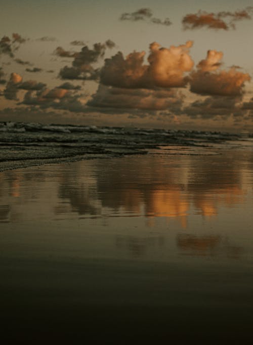 Clouds Reflection on the Beach