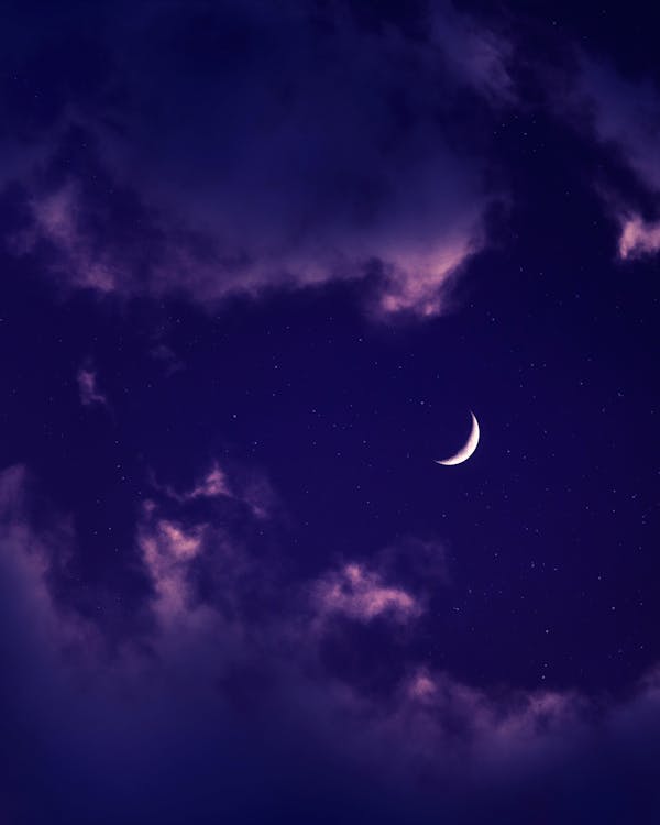 Crescent Moon Over a Purple Sky
