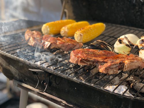 Free Photograph of Meat Being Grilled Stock Photo