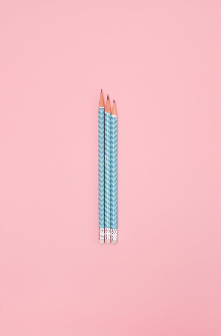 Sharpened Pencils On A Pink Surface 