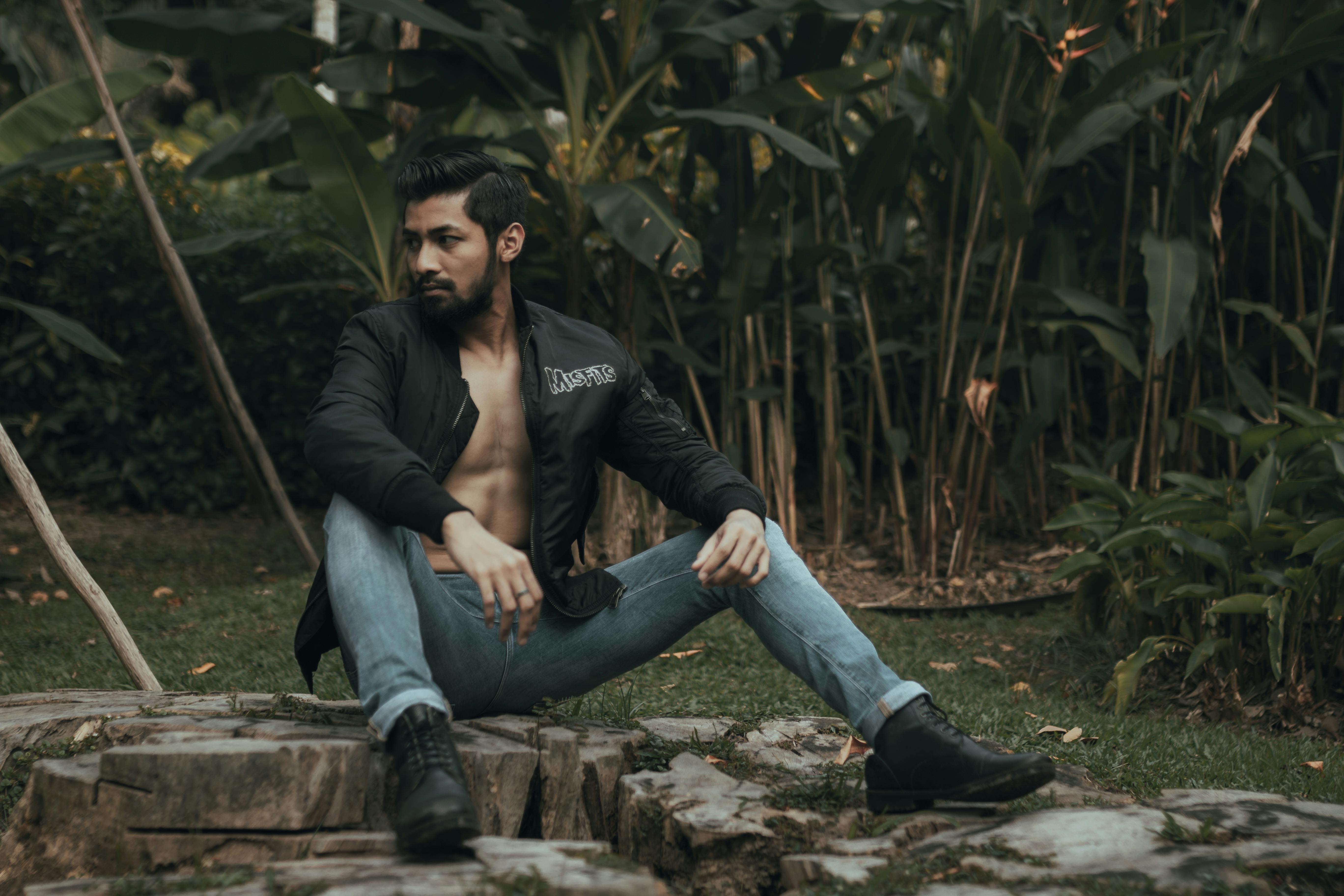 Handsome Man posing on outdoor. Men Model Stock Image. Young Man differnt  type of Poses in the forest and enjoy beautiful nature and trees Stock  Photo - Alamy