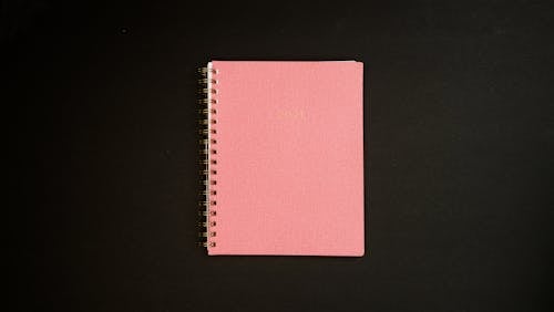 Overhead Shot of a Pink Notebook