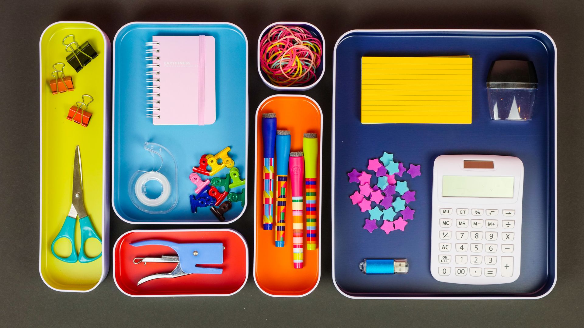 A Flatlay Office Stationery Materials on Organizers