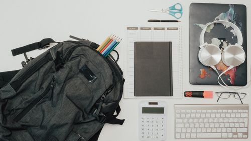 Free A flat lay of a clean and organized workspace with various office supplies. Stock Photo