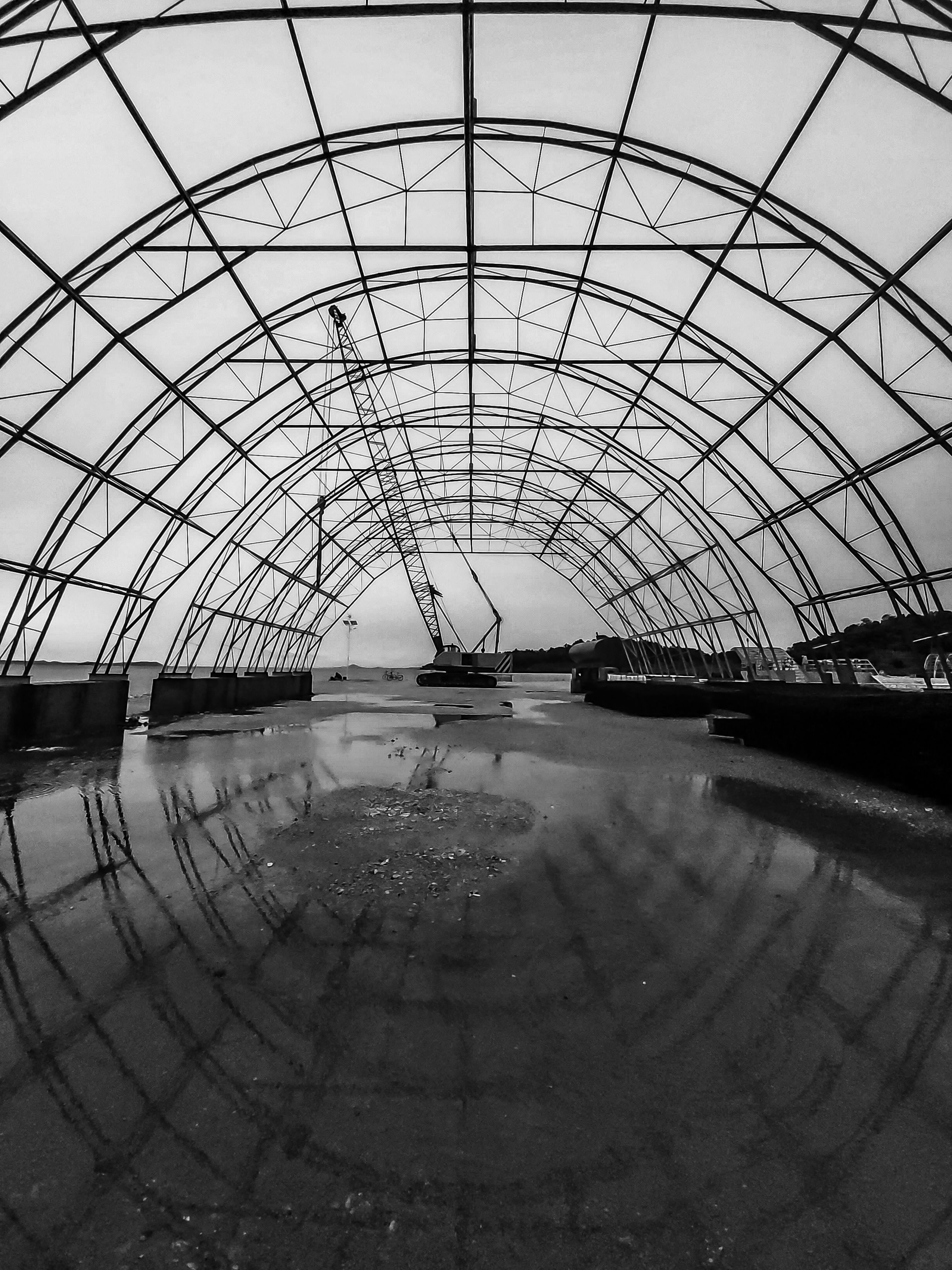 Black and White Photo of Construction Site and Crane · Free Stock Photo