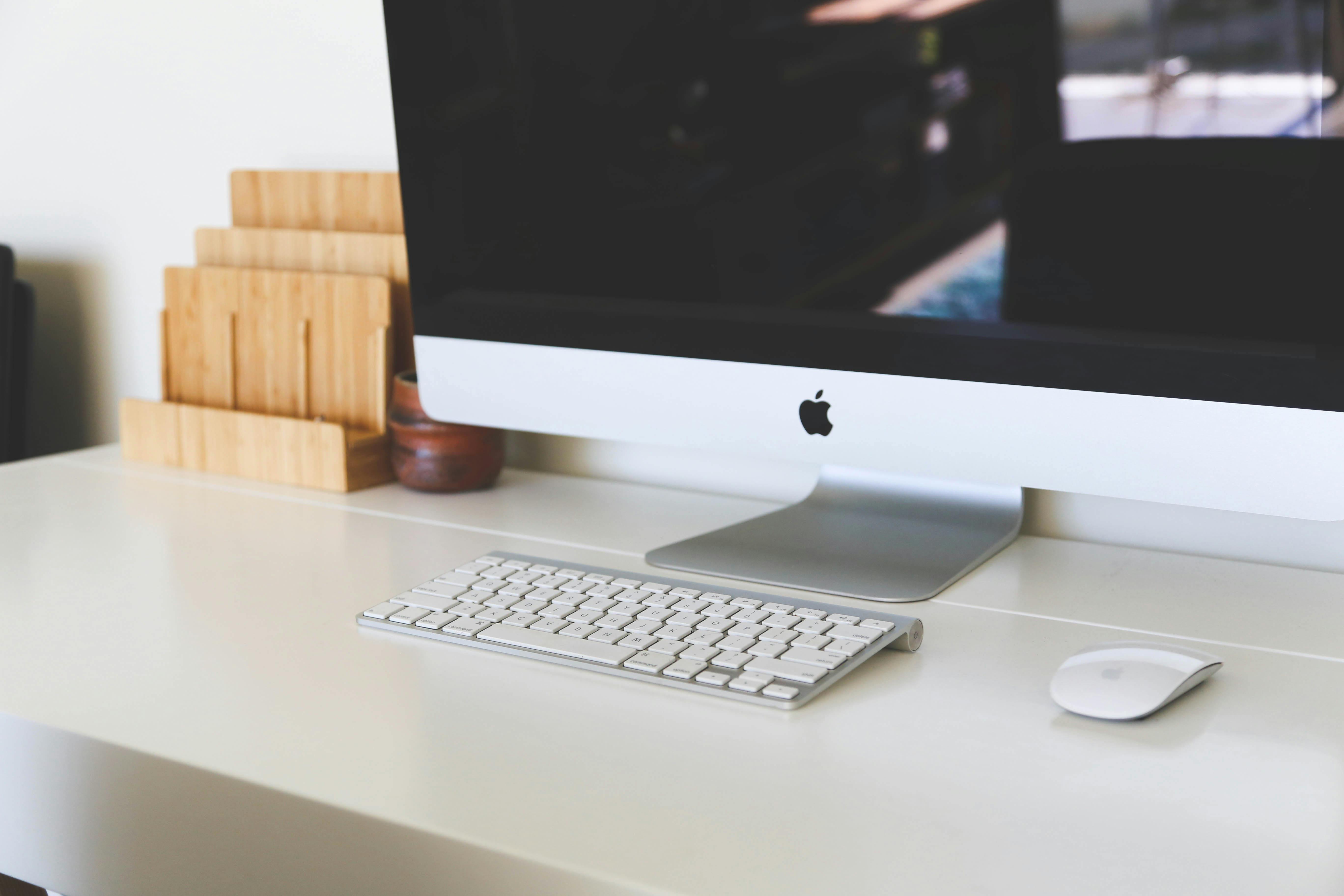 Silver Imac Set On Table Free Stock Photo