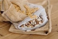 White and Brown Stones on White Textile