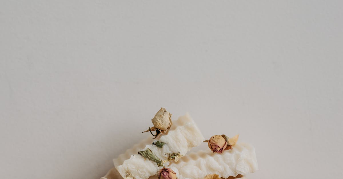White Bar Soaps With Roses on a Ceramic Tray