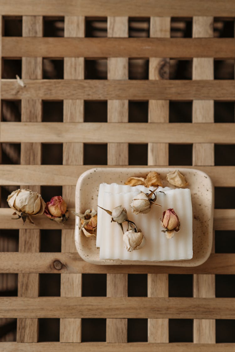 Dried Flowers And White Bar Soap On A Tray