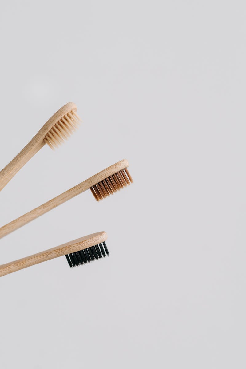Bamboo Toothbrushes on Gray Background