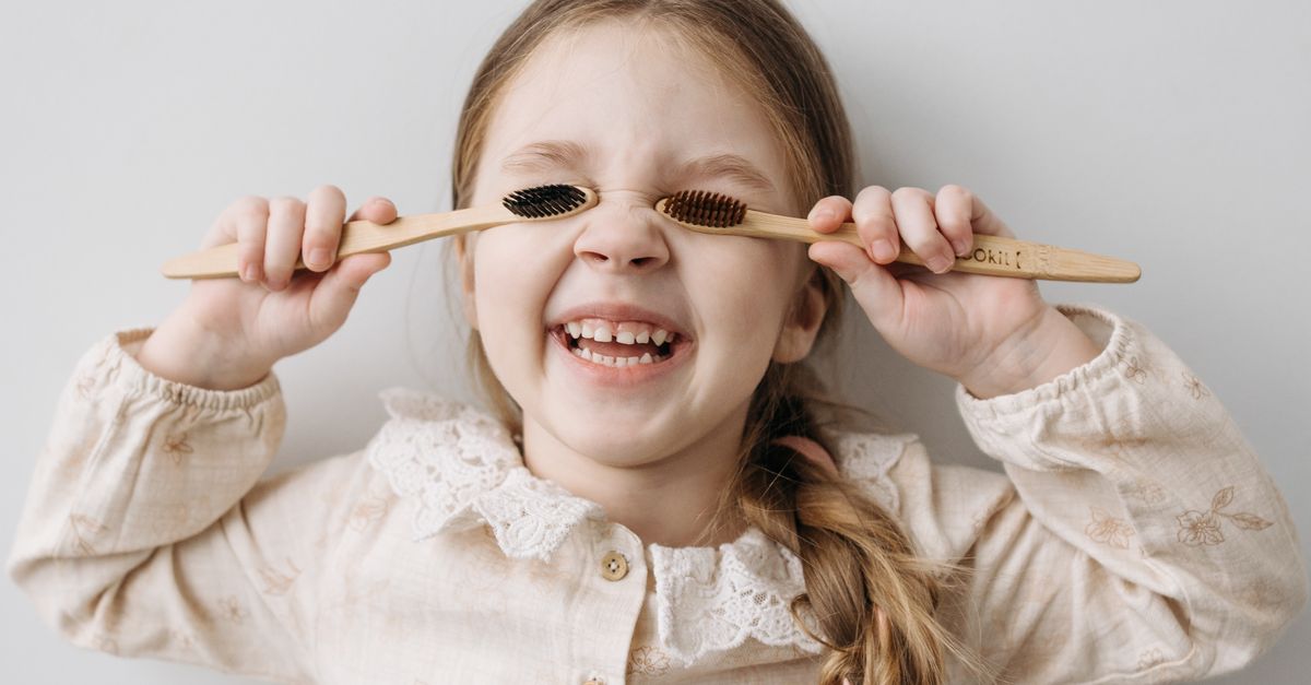 Toothbrush Playing A Child Playing with Toothbrushes · Free Stock Photo