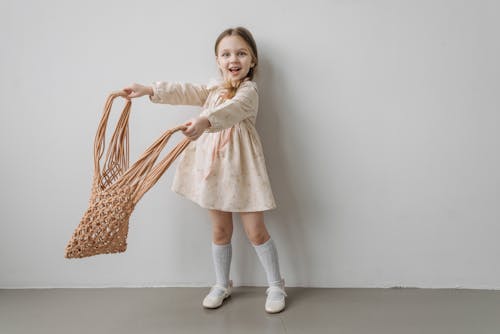 Free A Girl with White Socks Holding a Bag Stock Photo