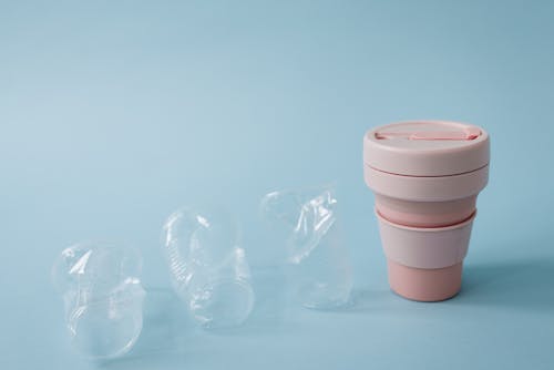 Clear Plastic Cups Beside a Collapsible Cup