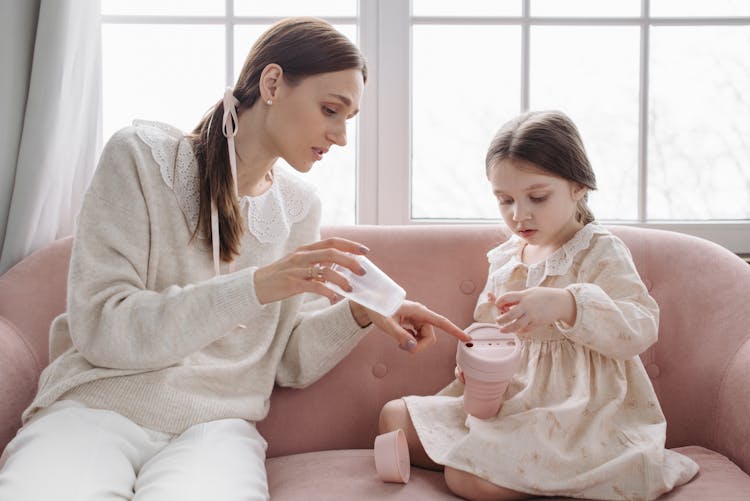 Woman And Child Wearing Long Sleeves Holding Reusable Pink Mug