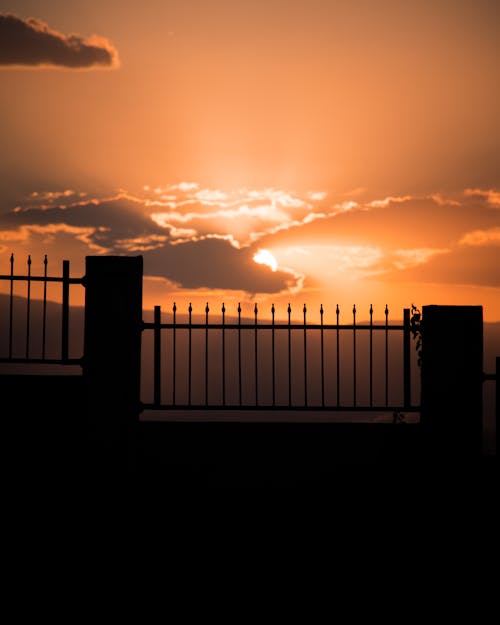 Silhouette of a Fence during Sunset
