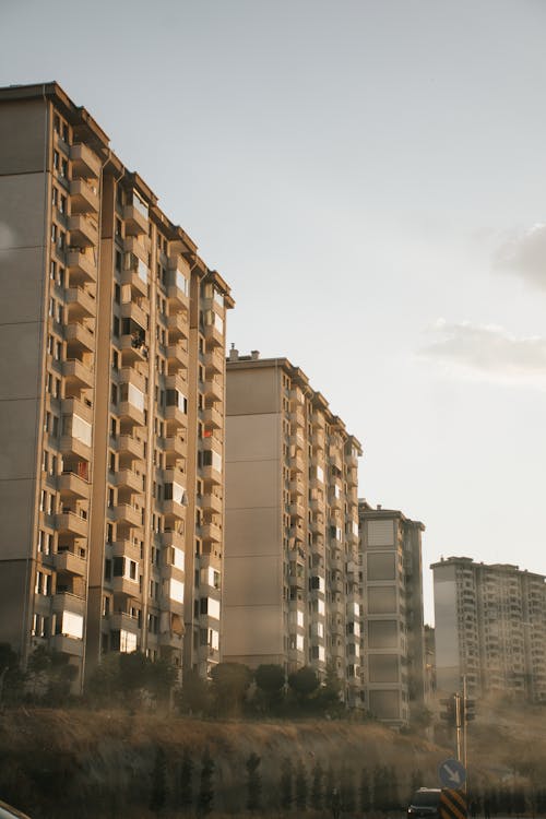 High Rise Concrete Apartment Buildings Under a Blue Sky