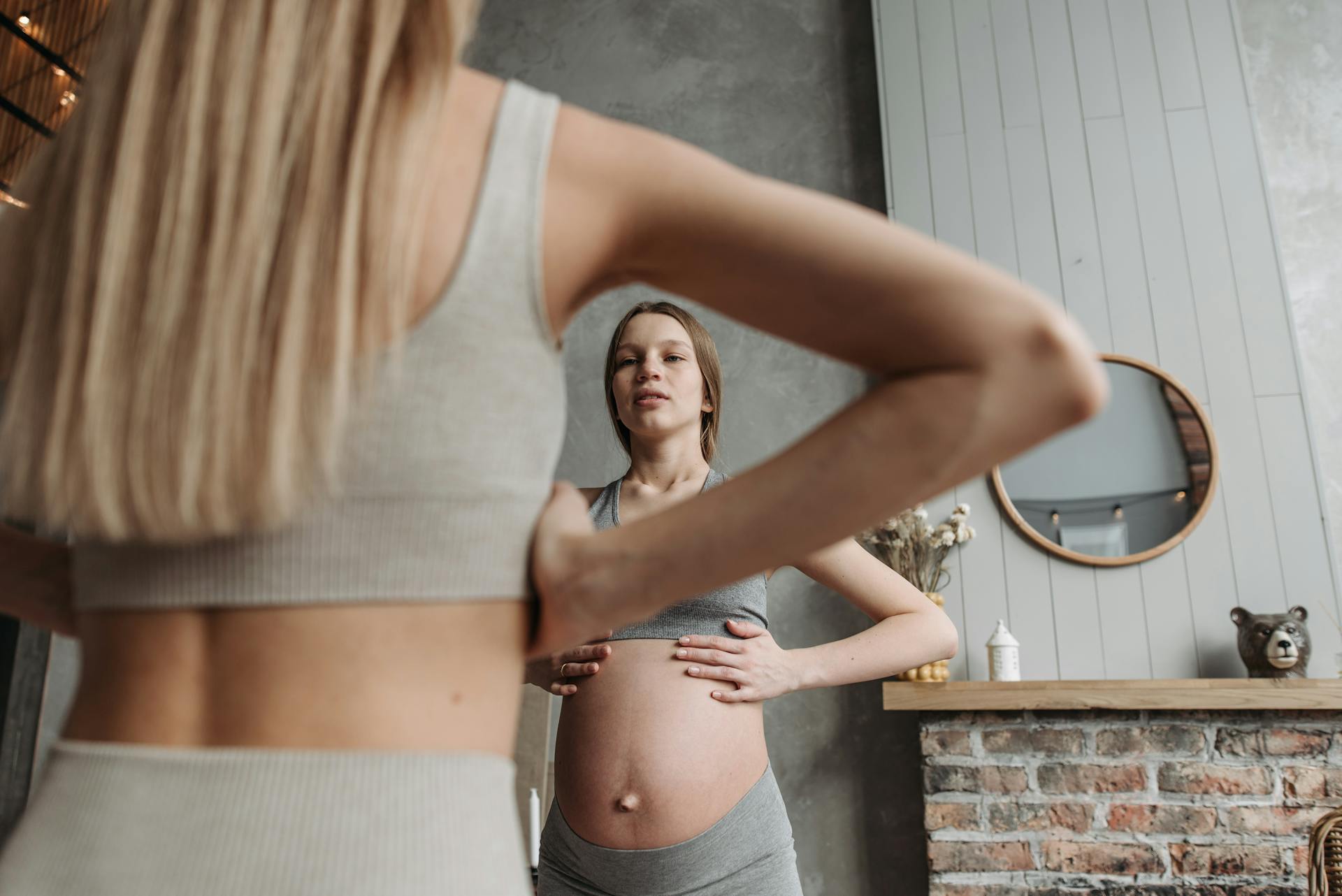 Pregnant Woman in Gray Tank Top and Gray Leggings