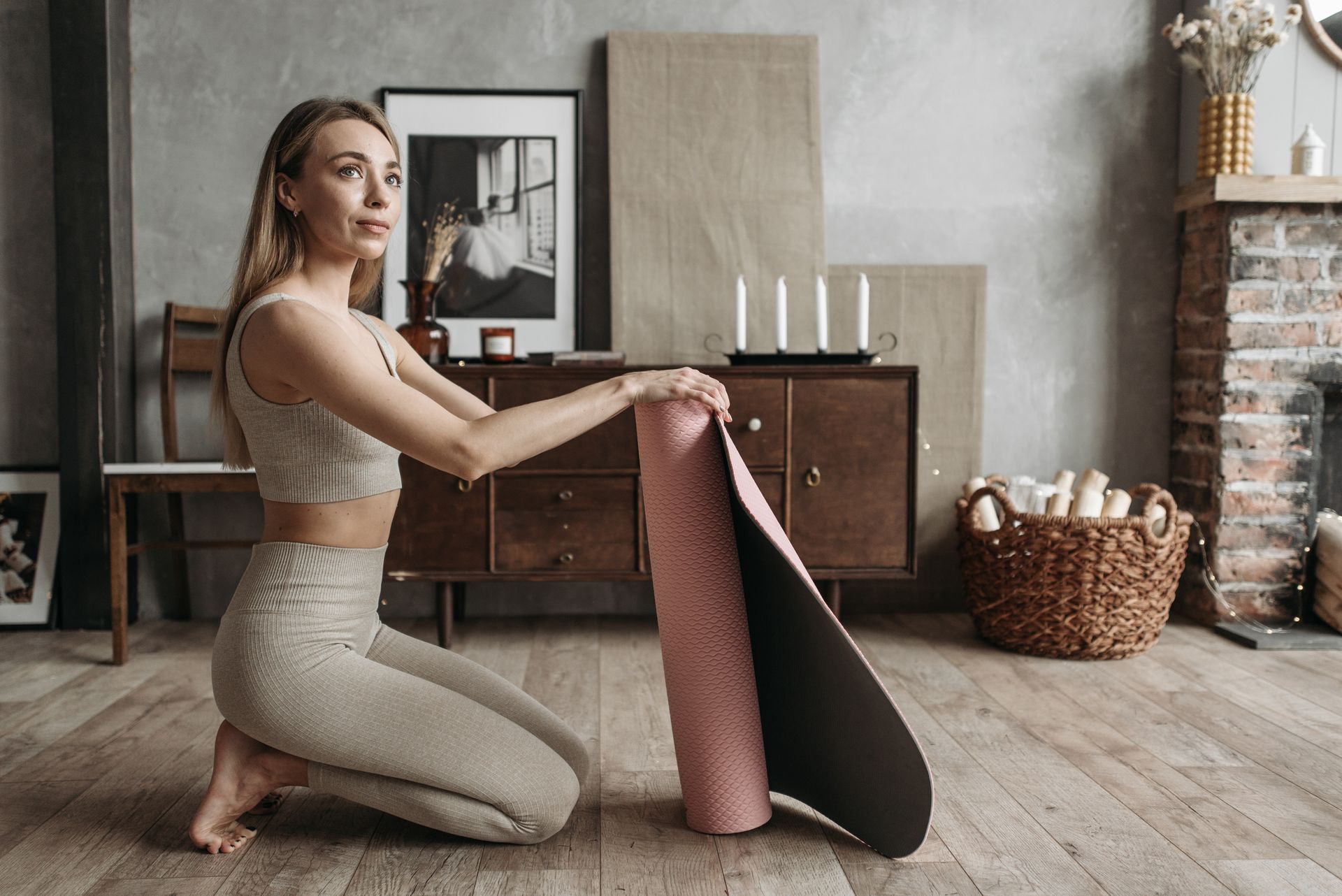 A Woman in Active Wear Exercising Indoors at Home