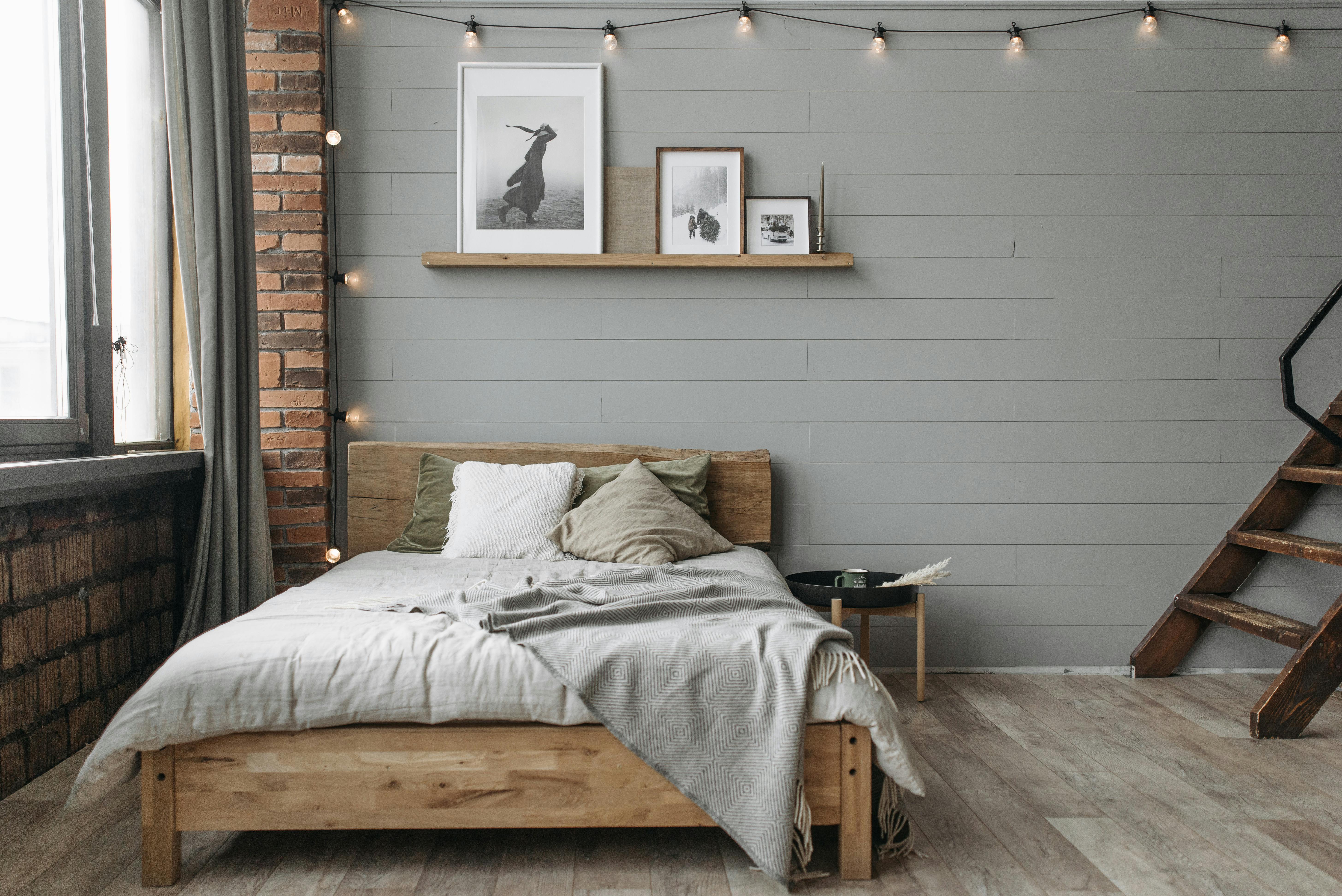 Bedroom with gray walls and wooden floor