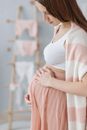 A Woman Rubbing Her Pregnant Belly