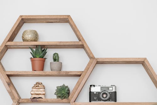 Free Assorted Items on Wooden Shelves Stock Photo