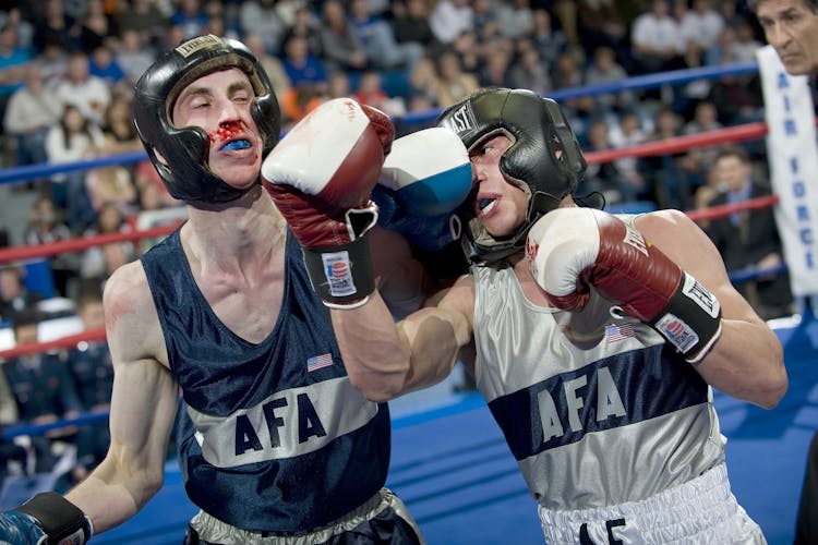 2 Men Boxing On Ring