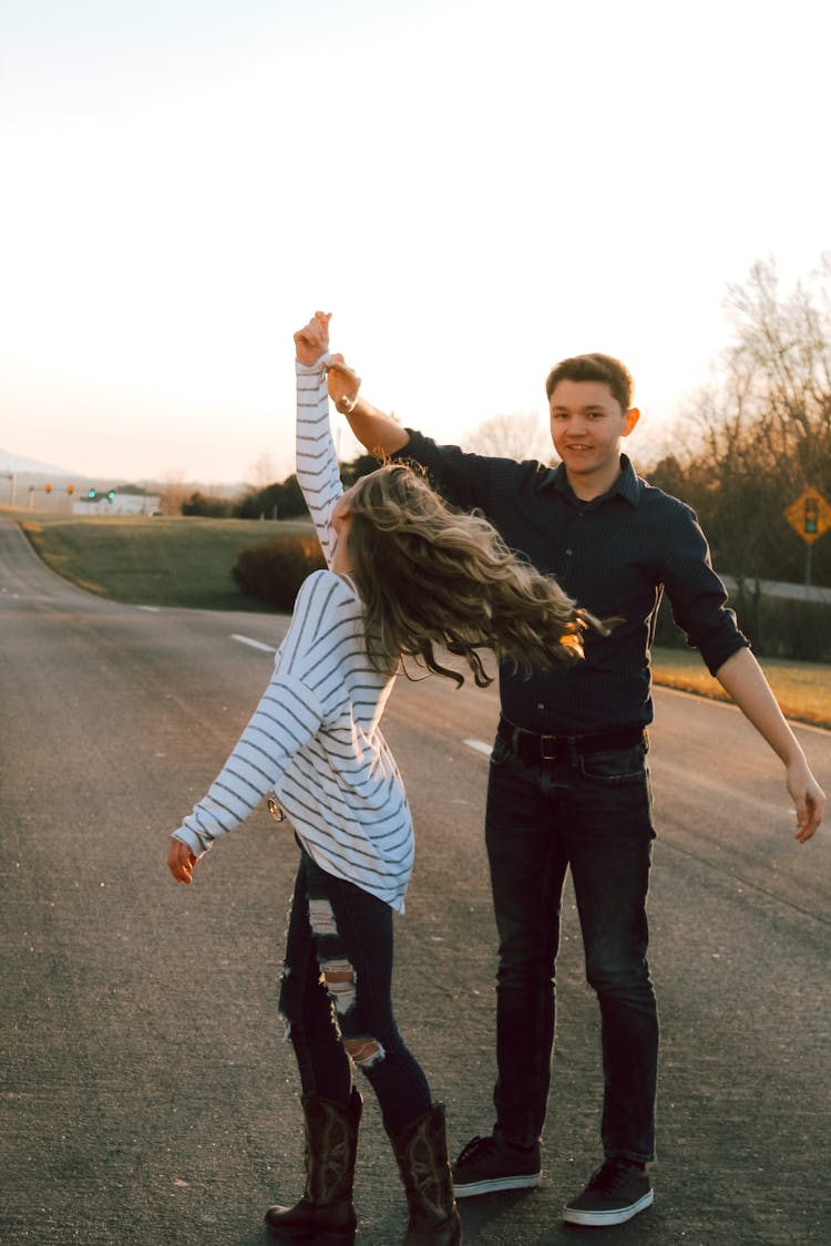 A Couple Dancing On A Street