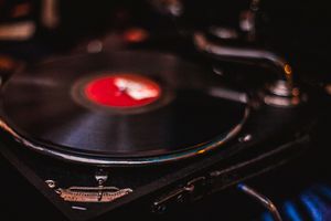 Vinyl record spinning on a turntable — photo by Francesco Paggiaro on Pexels
