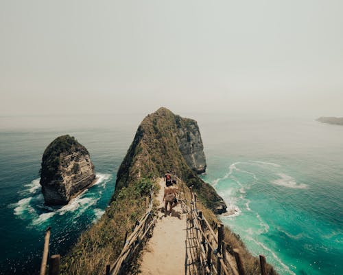 

People Walking on a Trail on the Mountain Peak of the Nusa Penida Island