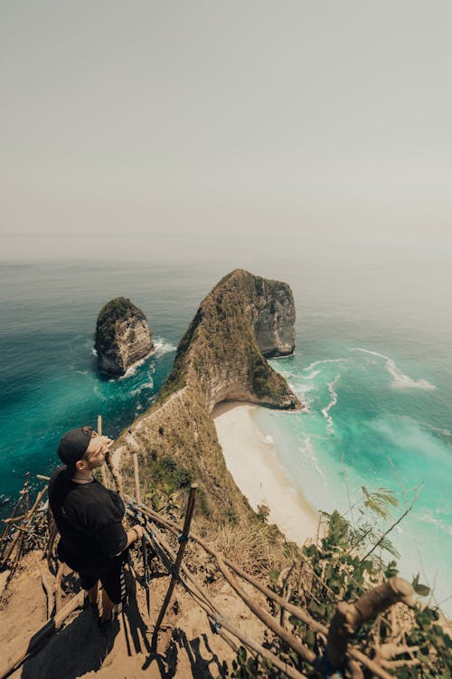 Unrecognizable man on rocky coast