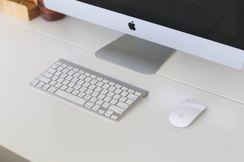 Ilmainen kuvapankkikuva tunnisteilla apple, iMac, kirjoituspöytä Kuvapankkikuva