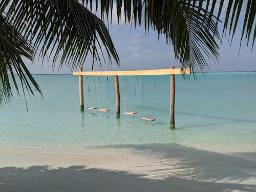 Sea with swings near shore