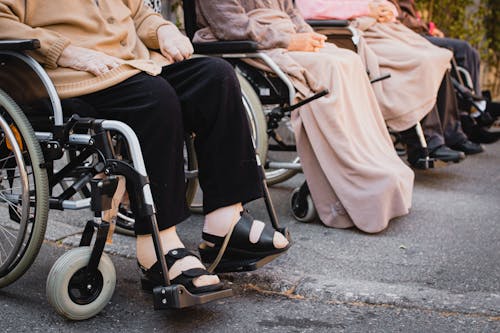 People Sitting on Wheelchairs