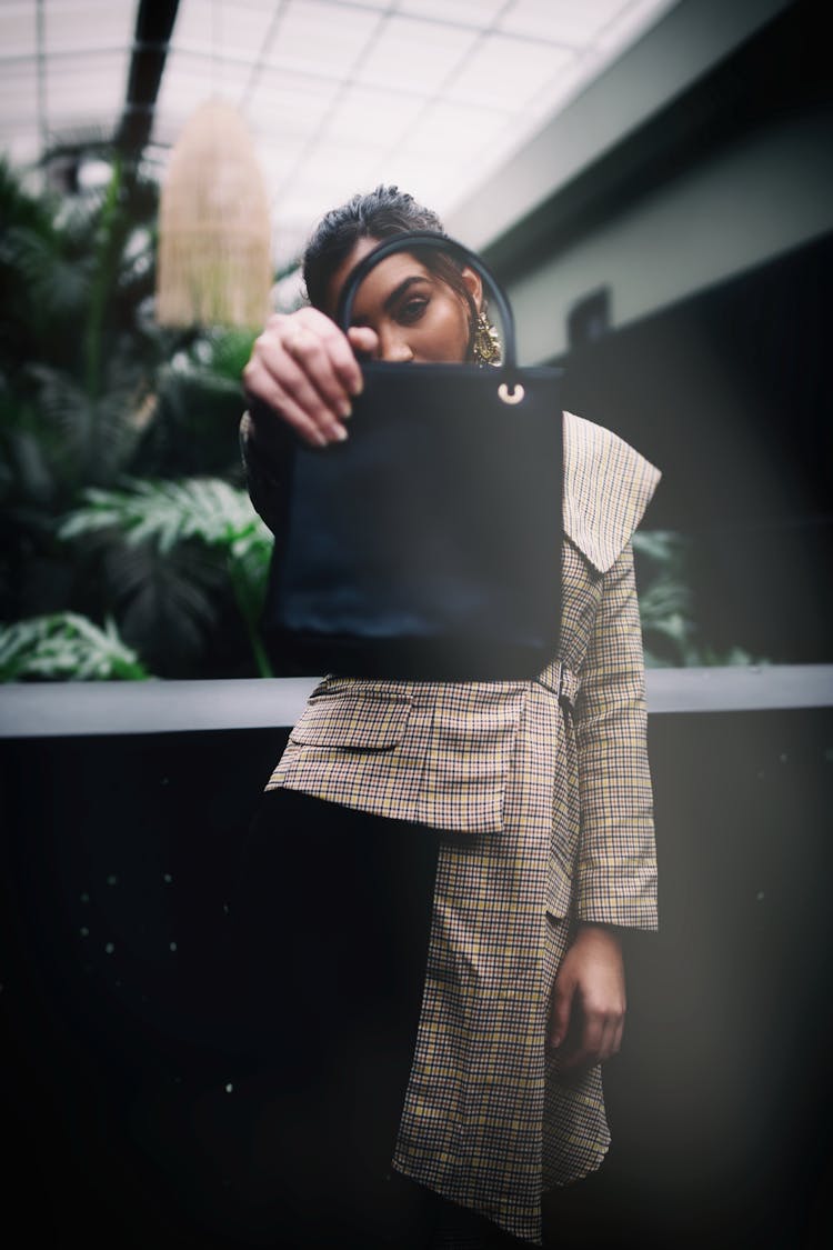 Photo Of A Stylish Woman Holding Her Black Purse