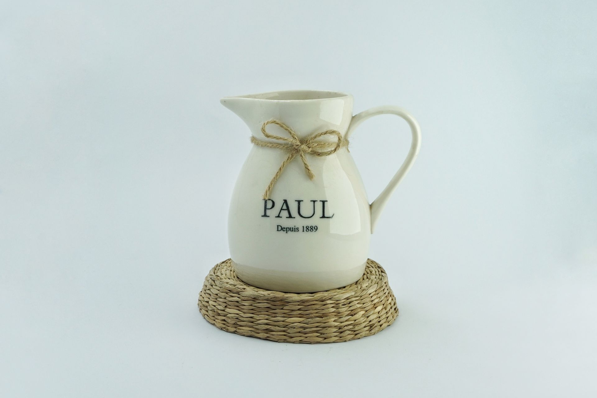 A White Pitcher with Printed Name
