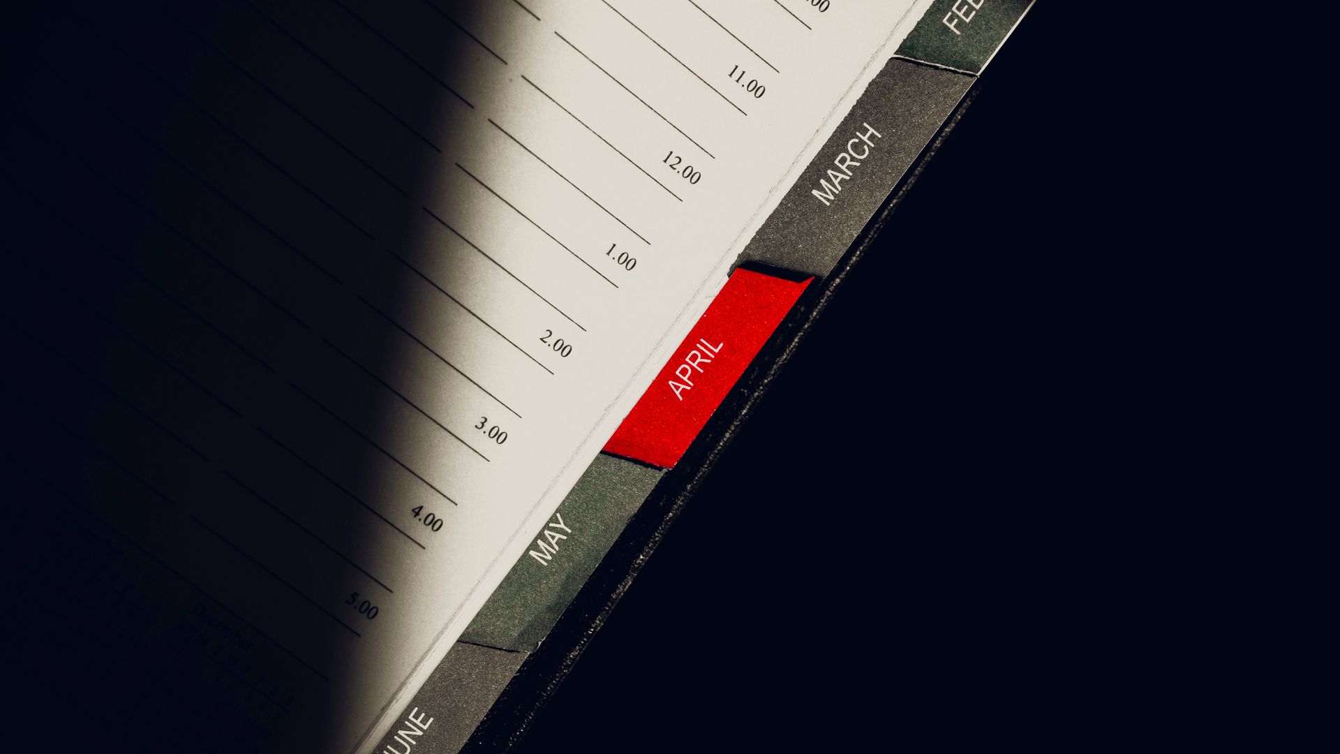 Modafinil Tolerance Break Schedule: A Comprehensive Guide A close-up shot of a planner highlighting the month of April with visible monthly tabs — modafinil tolerance break schedule
