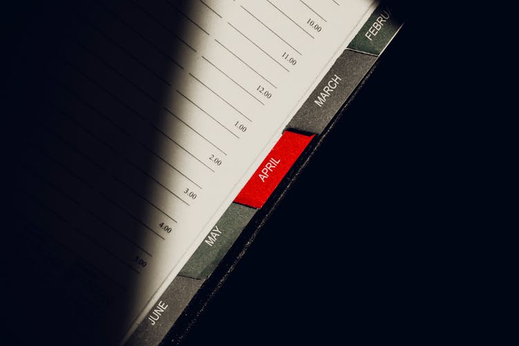 A Close-Up Shot Of The Tabs Of A Planner