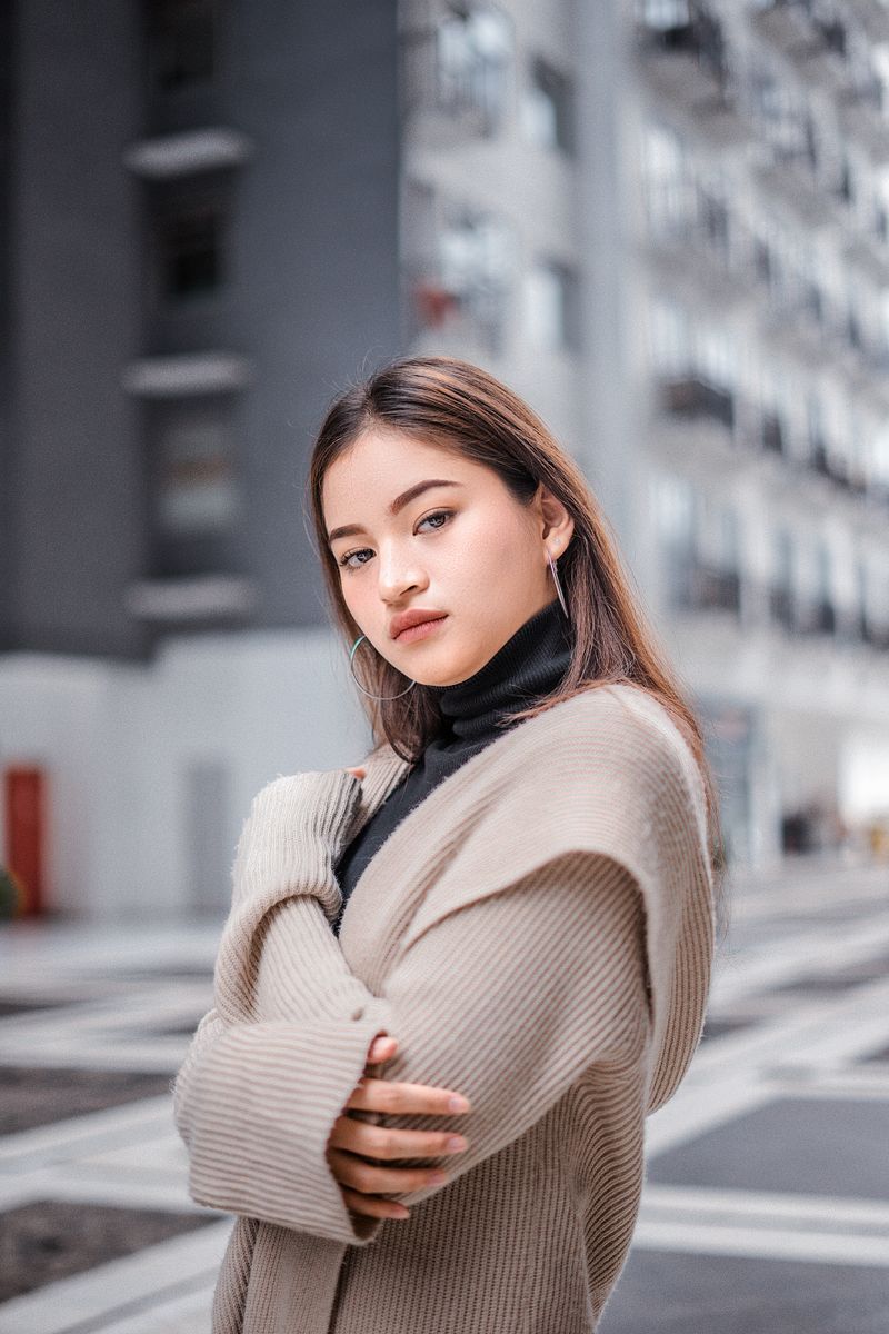 woman in a layered knit and dress outfit
