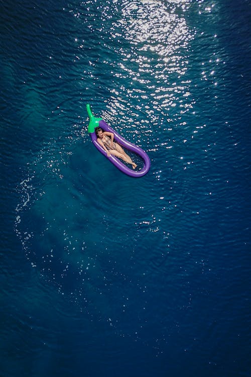 Free Drone Shot of a Woman on a Floater Stock Photo