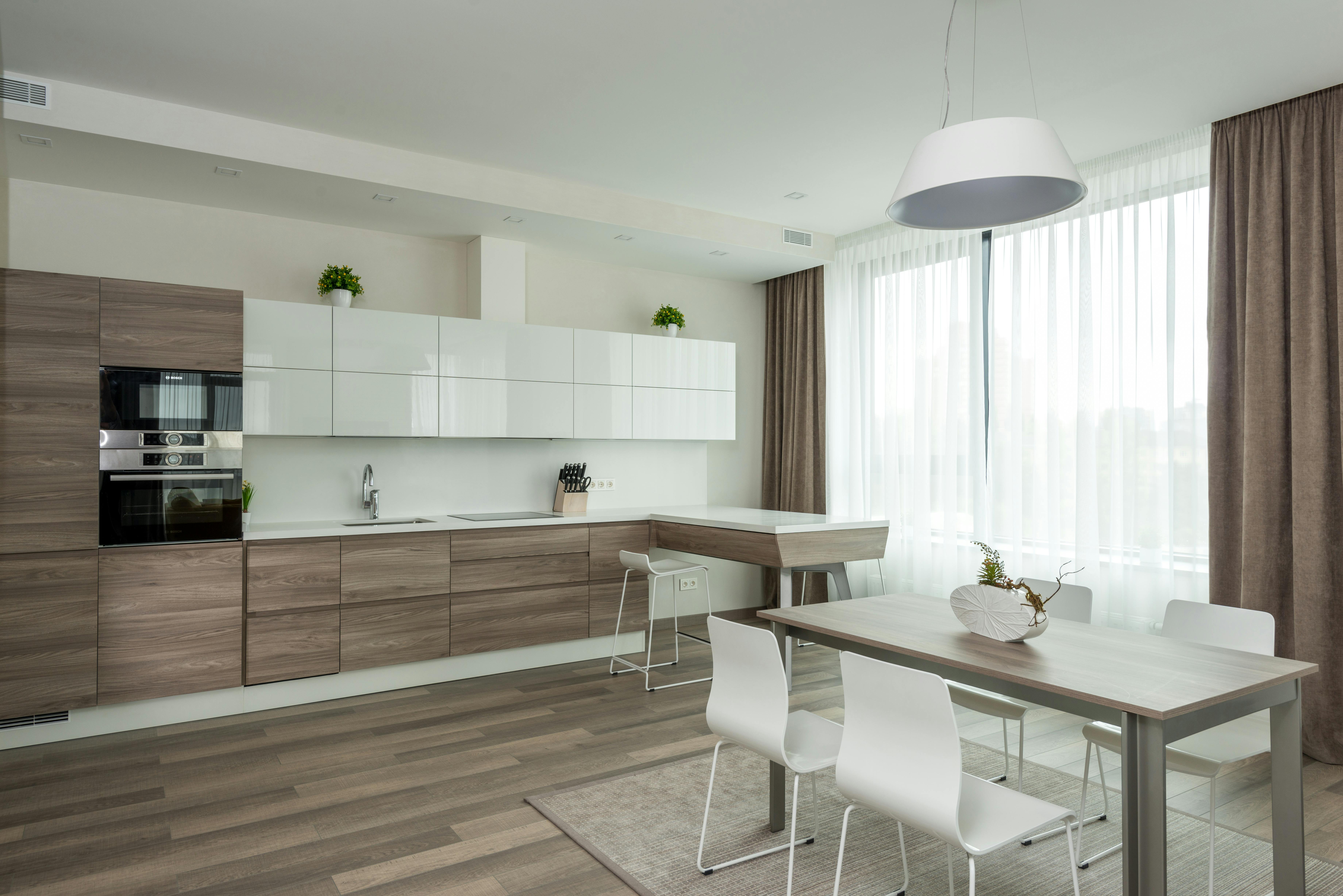 spacious kitchen with dining zone and minimalist furniture
