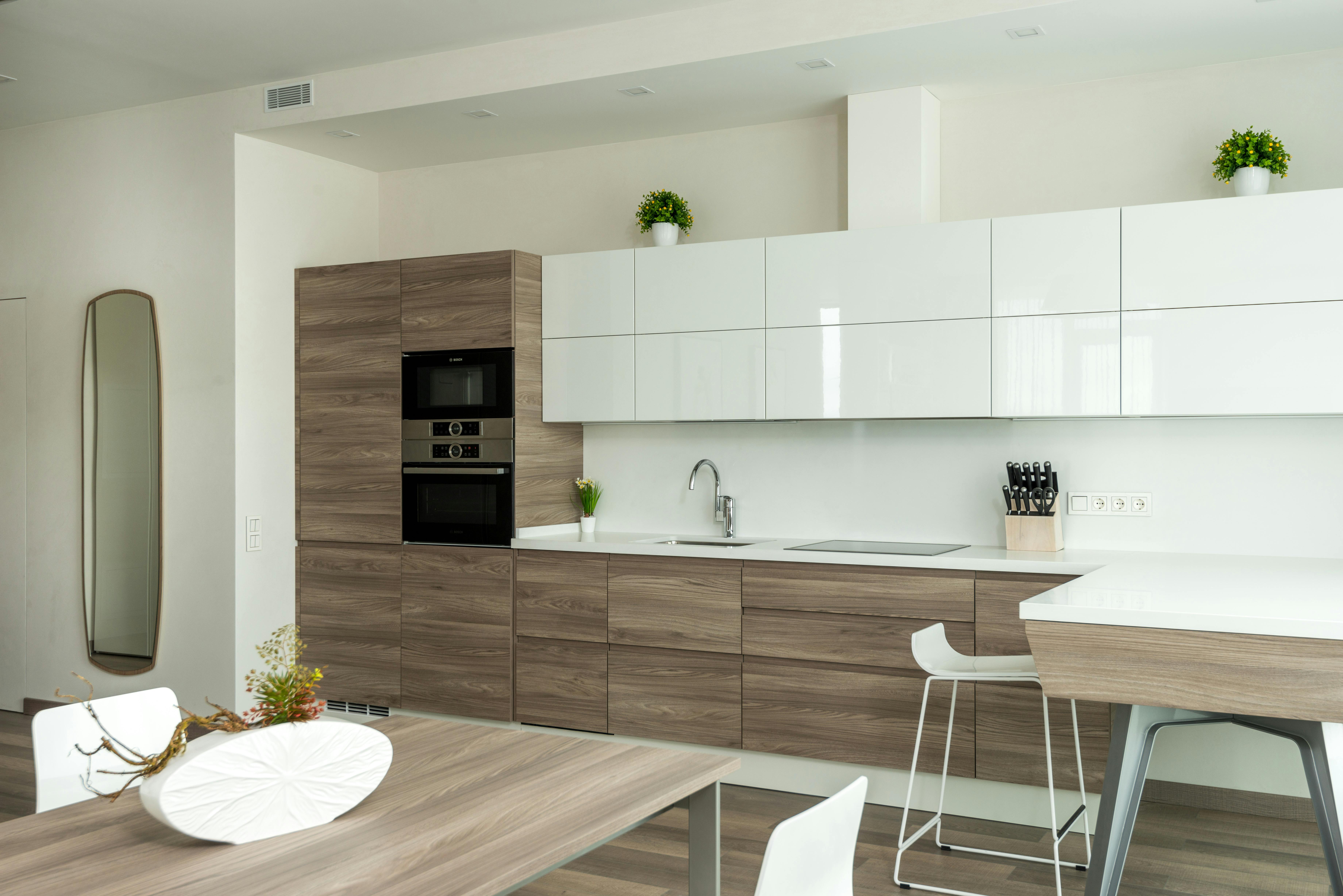 kitchen with modern furniture and appliances in minimalist apartment 