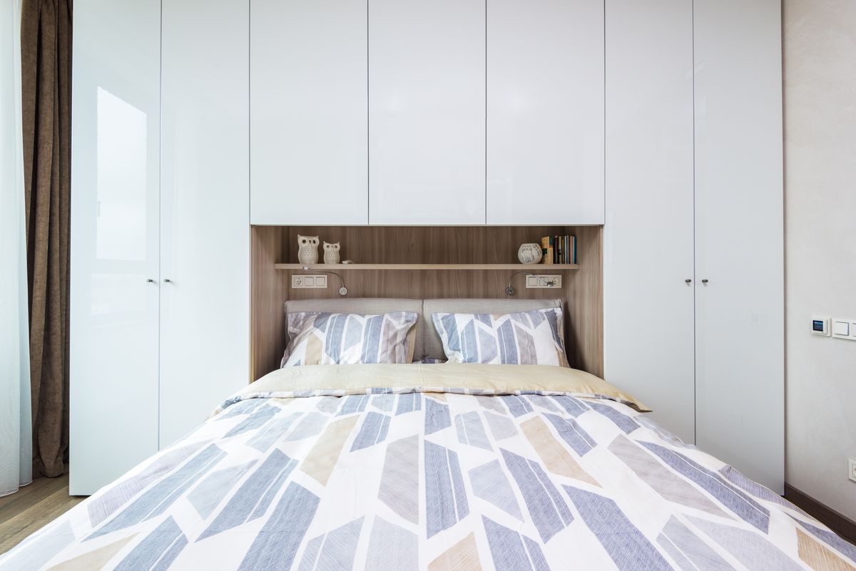 Contemporary bedroom with built in wardrobe and shelf