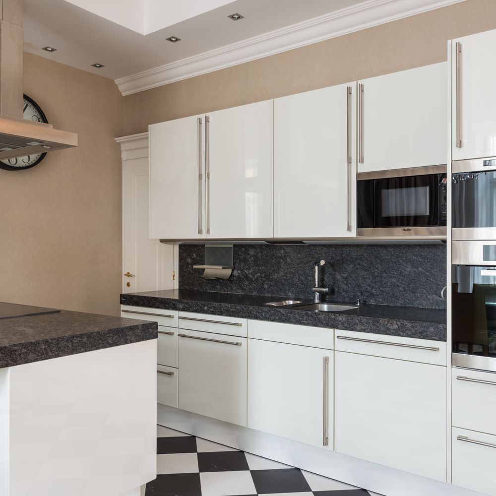 Kitchen Spraying in Yeading — clean edges cut in around trim and sockets